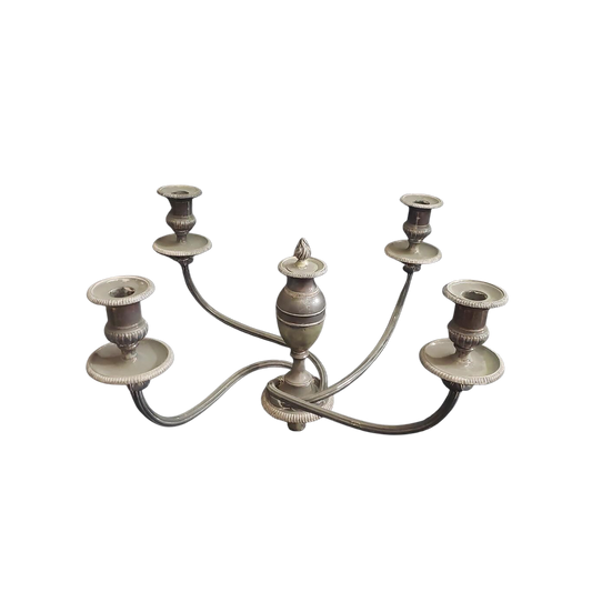 Decorative metal candelabra on a white background